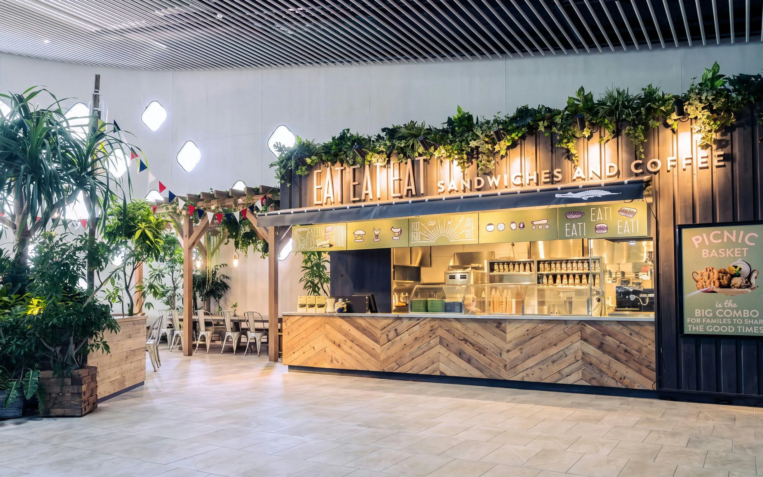 NIFREL Interactive Aquazoo cafe with greenery and seating area.