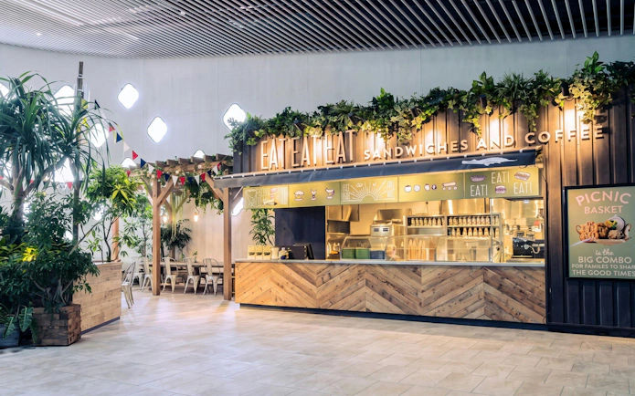 NIFREL Interactive Aquazoo cafe with greenery and seating area.