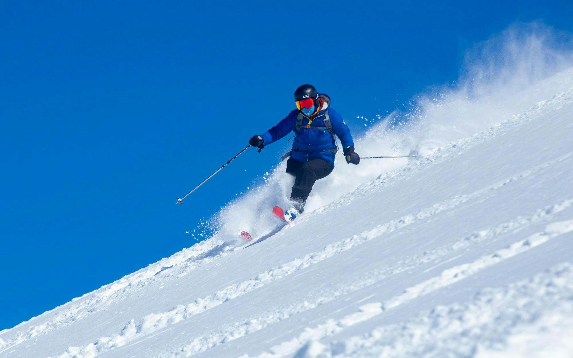 Tourist skiing downhill at Farellones Ski, Chile.