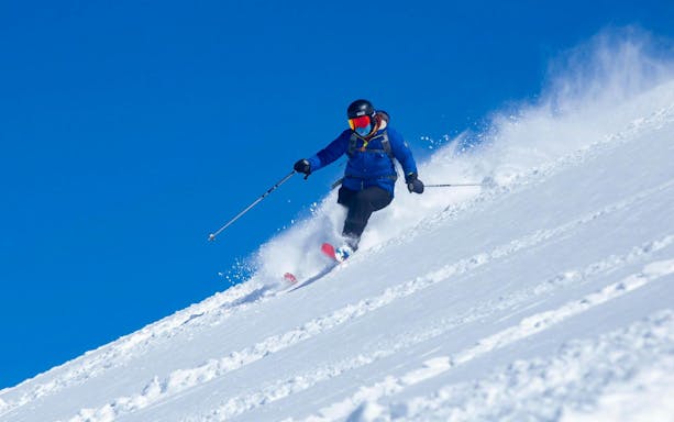 Tourist skiing downhill at Farellones Ski, Chile.