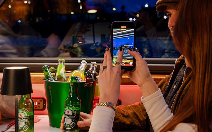 Guests enjoying drinks on the Lovers Canal Cruise in Amsterdam.