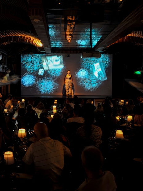 Audience enjoying Piazzolla Tango Show with performers on stage in Buenos Aires.