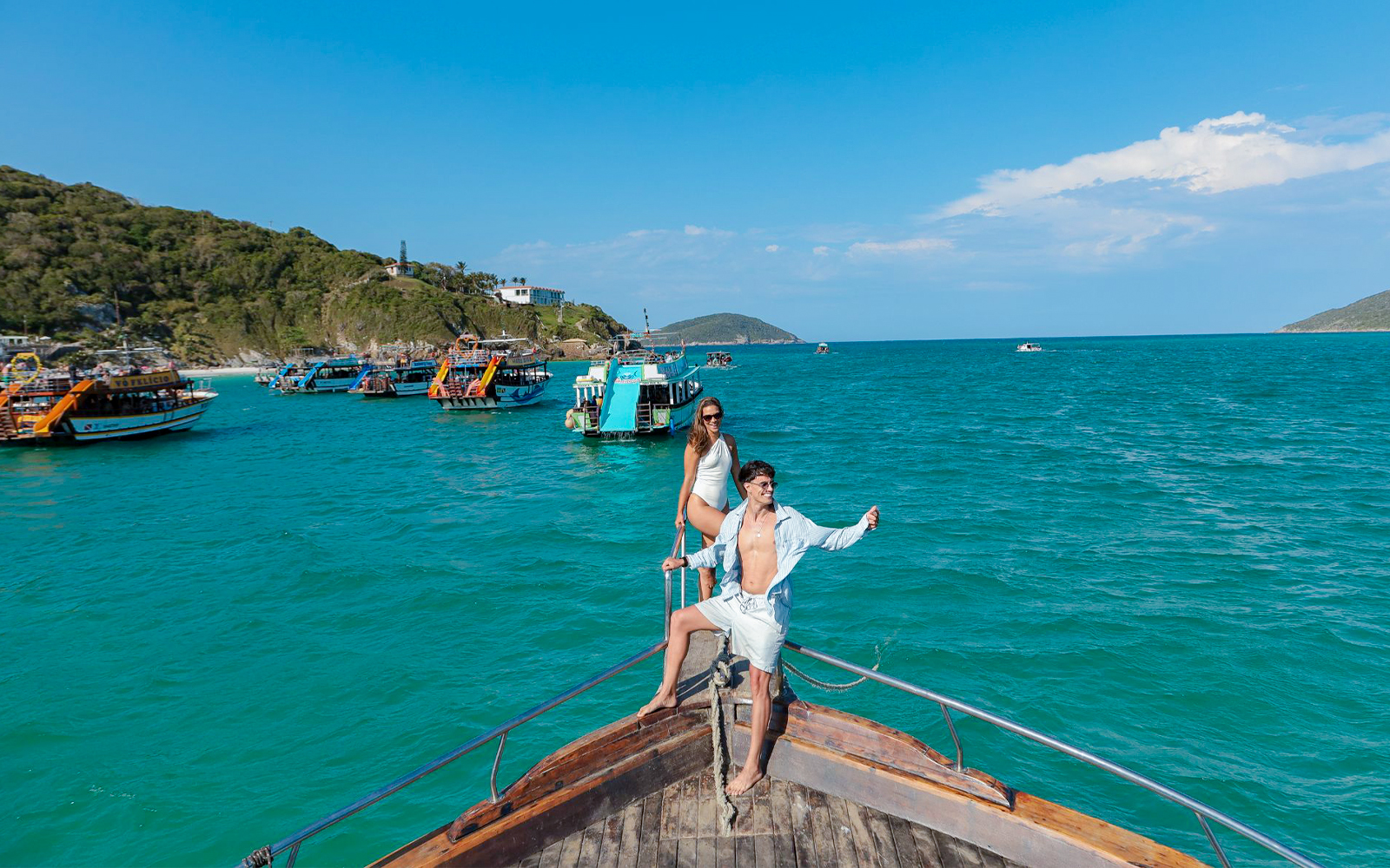 Tourists on a boat enjoying the Arraial do Cabo Full Day Tour with cruise in Brazil.