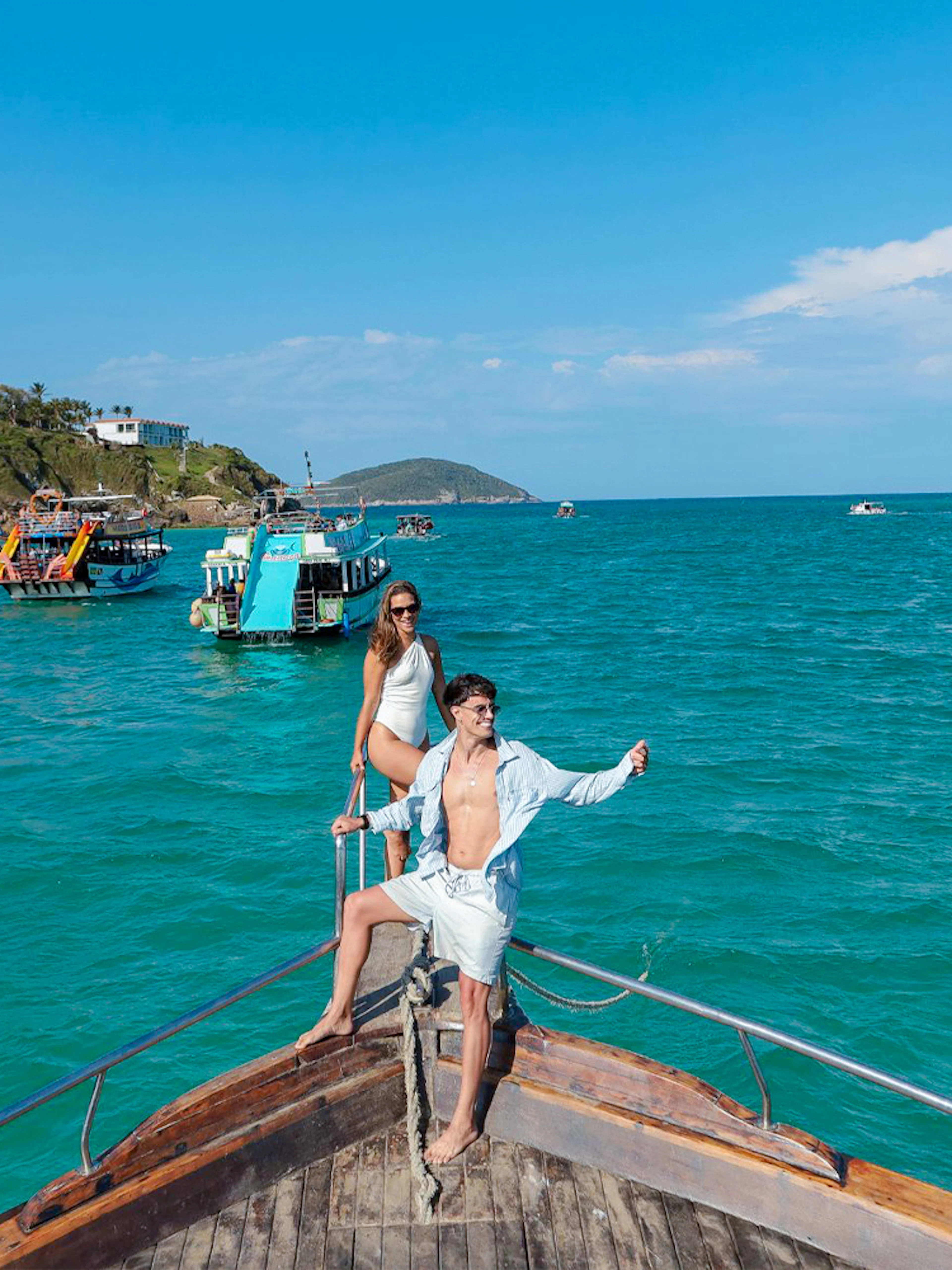 Tourists on a boat enjoying the Arraial do Cabo Full Day Tour with cruise in Brazil.