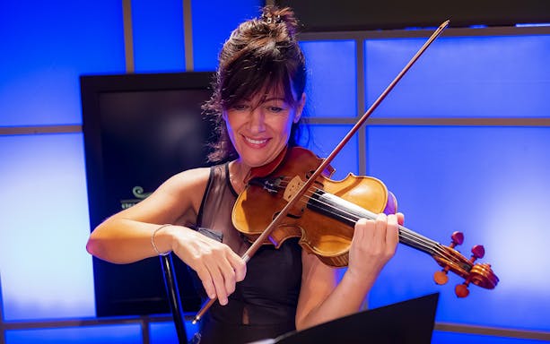 Violinist performing at Great Opera Arias Concert in Rome.