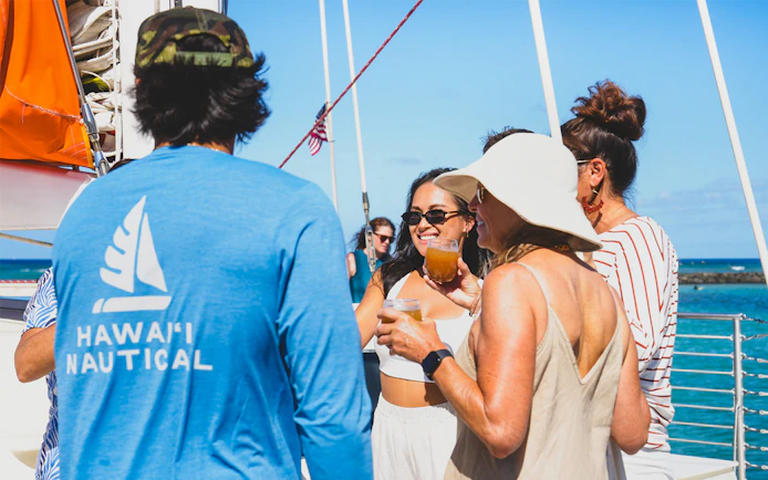 Group enjoying drinks on a Kaula Kai snorkel sail in Oahu.
