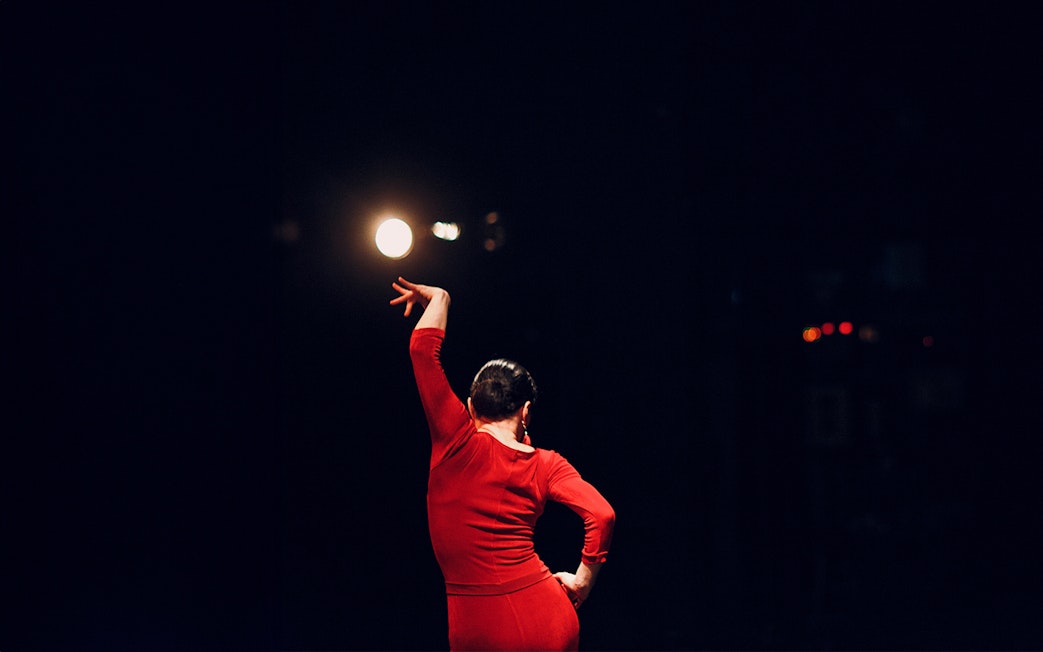 Flamenco dancer performing on stage at Las Setas, Seville.