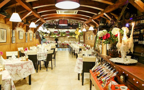 Folklore dinner show setup at a traditional Maltese restaurant with decorated tables.