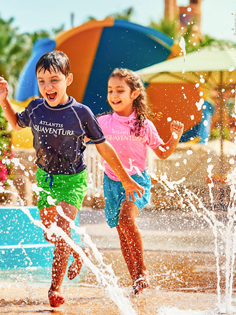 Children playing in splash area at Aquaventure Waterpark, Dubai.