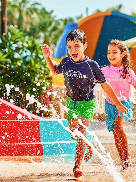 Children playing in splash area at Aquaventure Waterpark, Dubai.