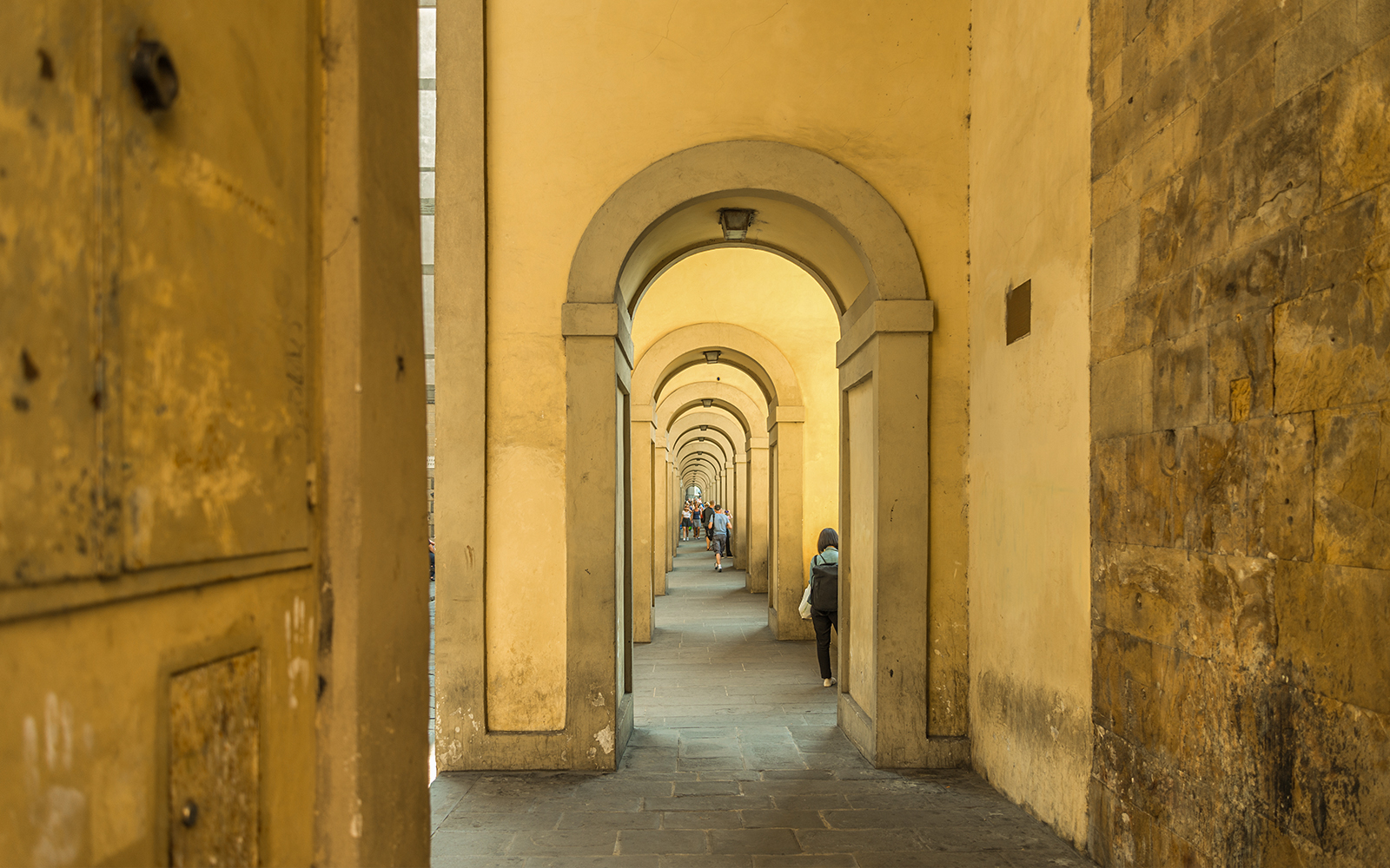 Arches of the Vasari Corridor in Florence, Italy, showcasing historic architecture and connecting landmarks.