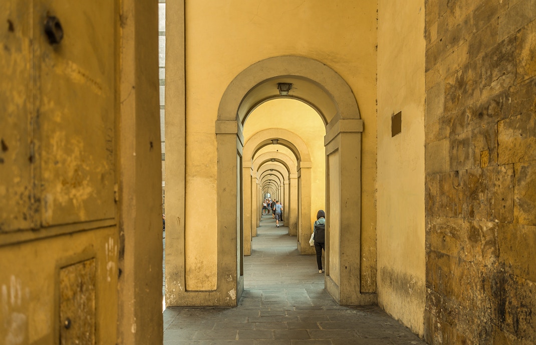 Arches of the Vasari Corridor in Florence, Italy, showcasing historic architecture and connecting landmarks.