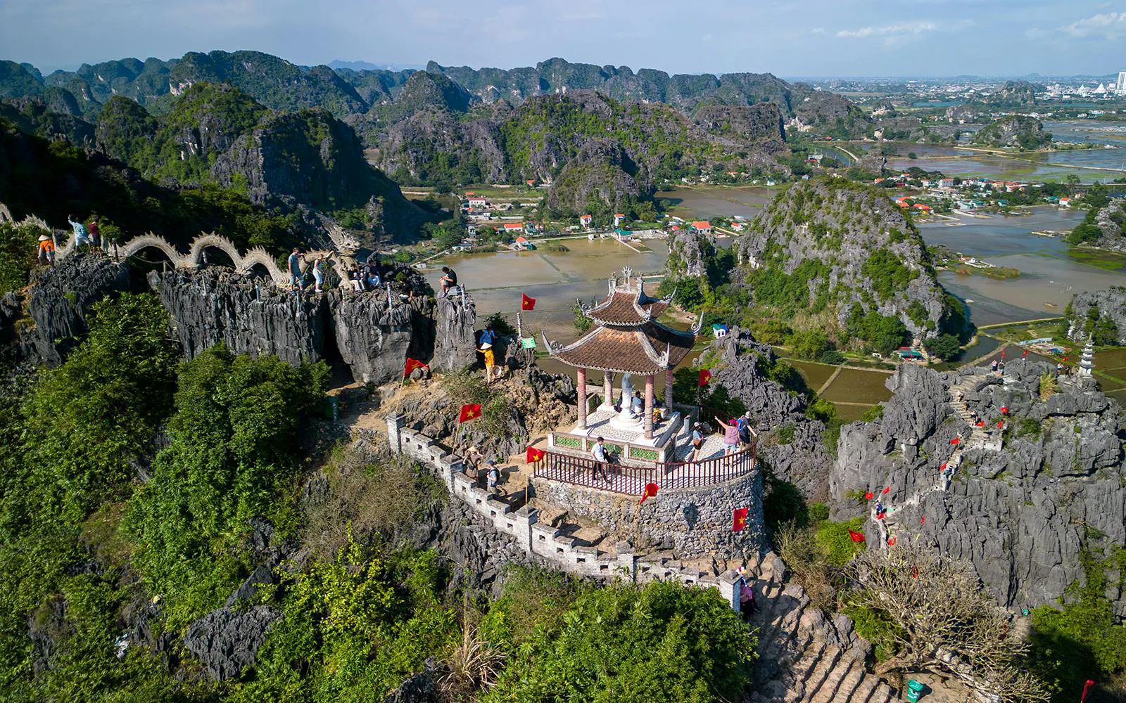 Aerial view of Hang Mua Viewpoint with pagoda and limestone karsts in Ninh Binh, Vietnam.