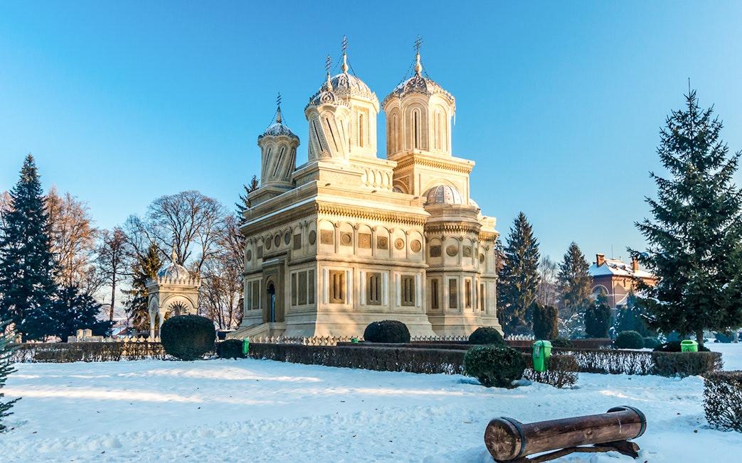 Curtea de Arges Monastery surrounded by snow in winter, Romania.