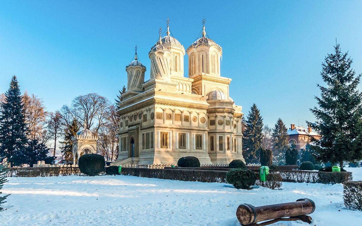 Curtea de Arges Monastery surrounded by snow in winter, Romania.