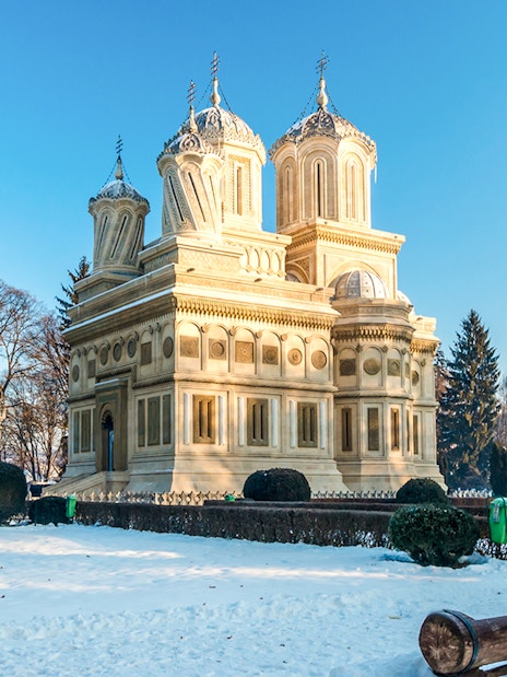 Curtea de Arges Monastery surrounded by snow in winter, Romania.