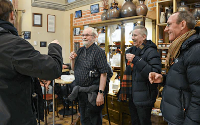 Group enjoying local drinks on Kraków street food tour.