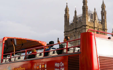 Open-top bus tour near Westminster Abbey, London.
