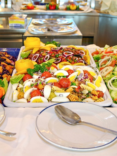 Buffet spread with salads and fruits on Budapest dinner cruise.