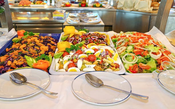 Buffet spread with salads and fruits on Budapest dinner cruise.