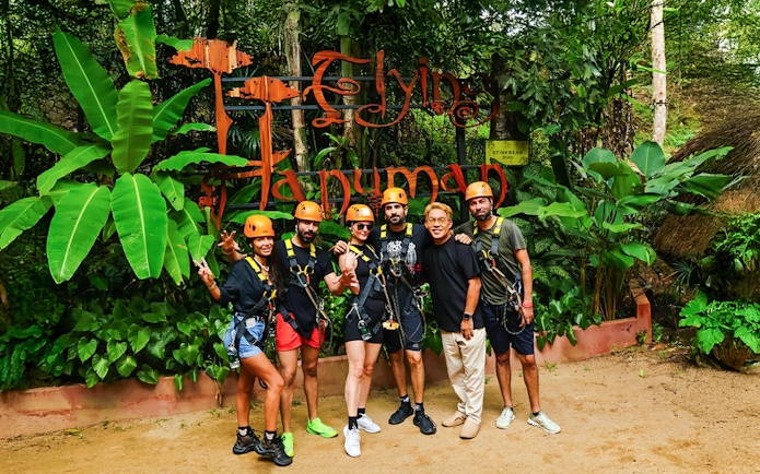 Group of people in harnesses at Flying Hanuman zipline in Phuket, Thailand.