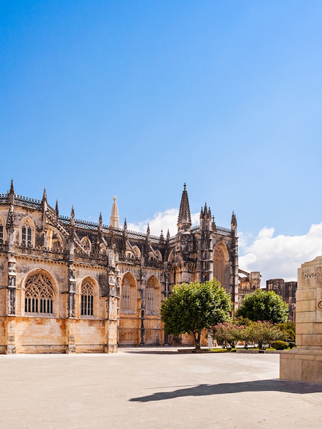 Batalha Monastery with equestrian statue in foreground, Batalha, Portugal.