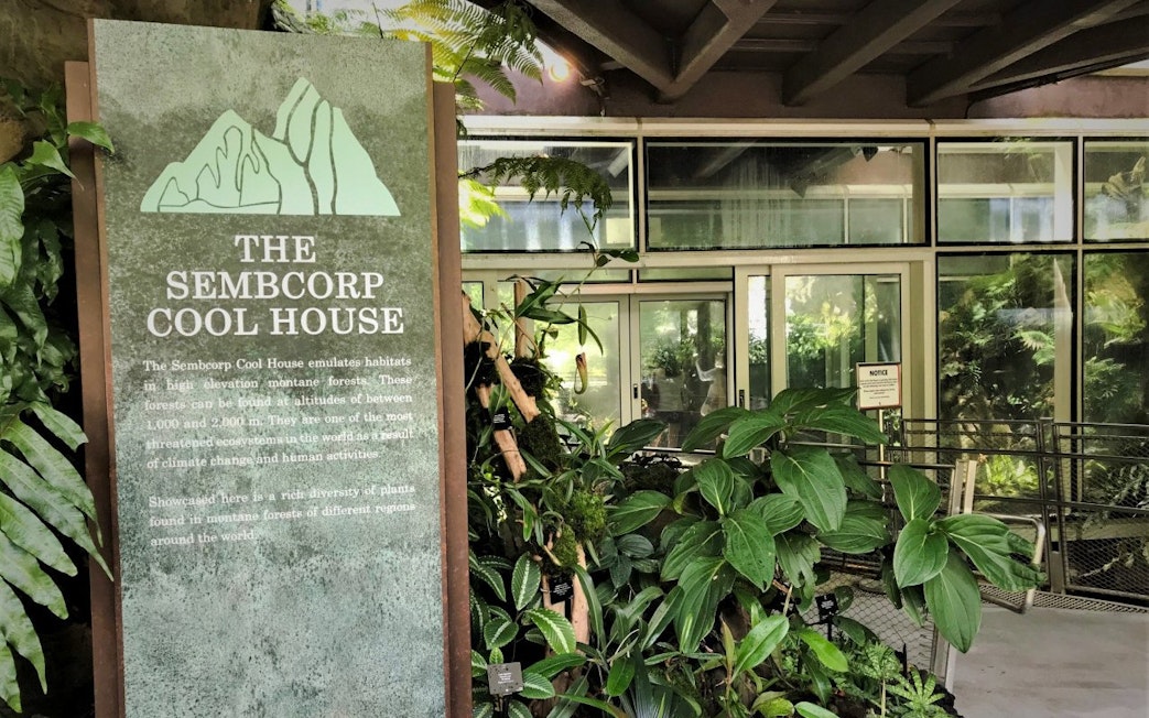 Sembcorp Cool House entrance with lush plants at National Orchid Garden, Singapore.