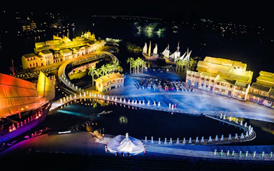 Aerial view of Hoi An Memories Show with illuminated stage and performers, Vietnam.