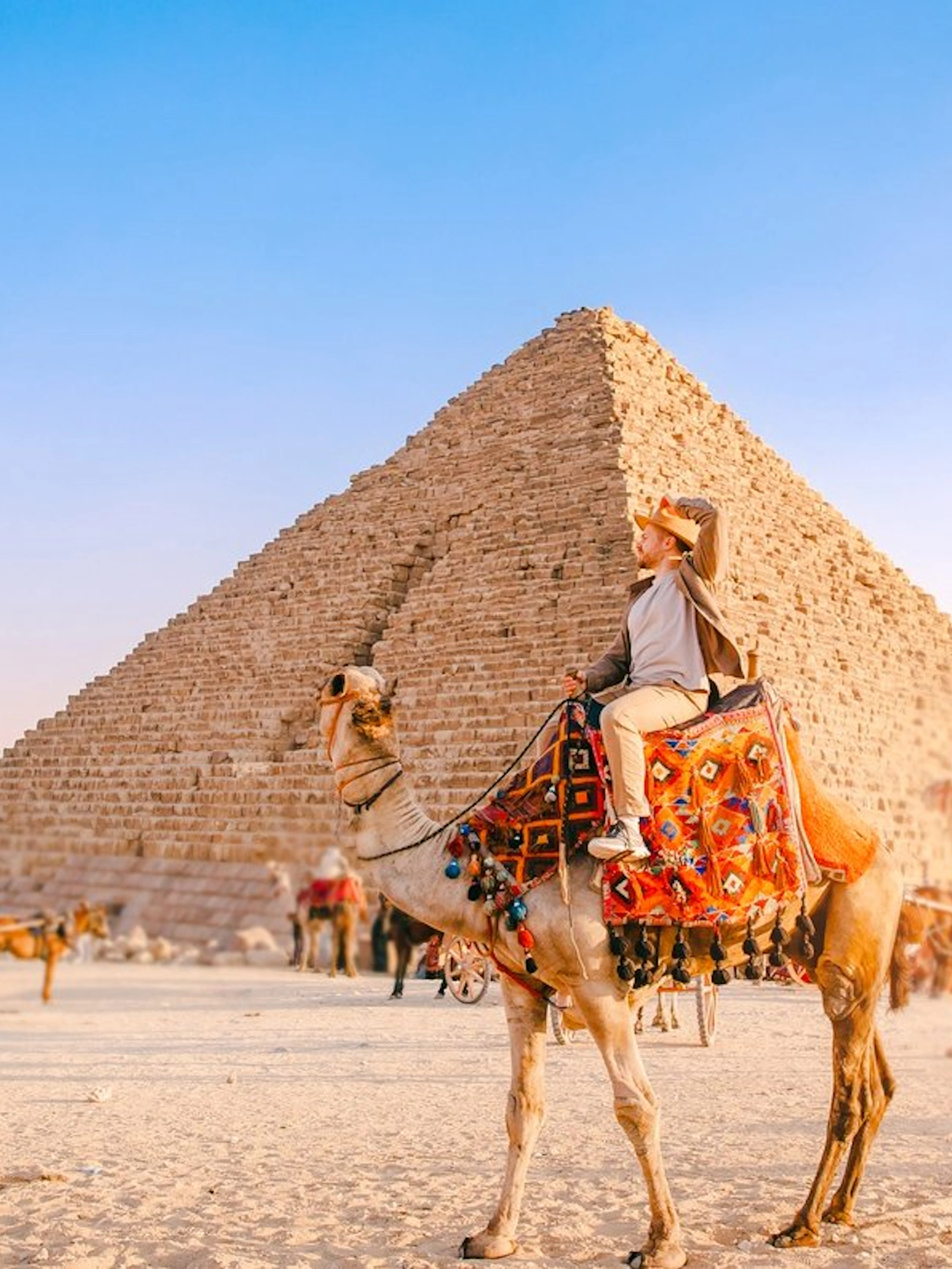Camel ride near the Pyramid of Khafre at the Giza Complex, Egypt.