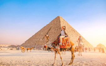 Camel ride near the Pyramid of Khafre at the Giza Complex, Egypt.