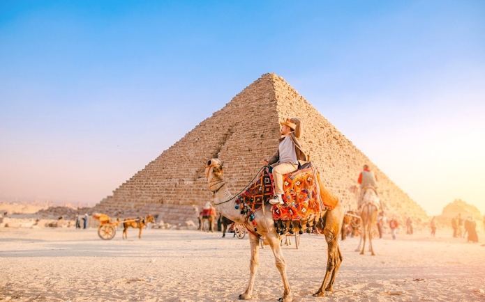 Camel ride near the Pyramid of Khafre at the Giza Complex, Egypt.