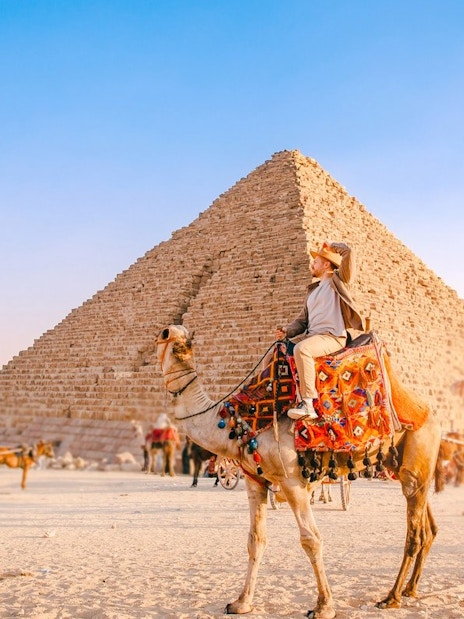 Camel ride near the Pyramid of Khafre at the Giza Complex, Egypt.