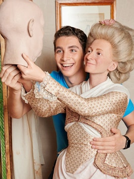 Man posing with wax figure at Madame Tussauds Berlin.