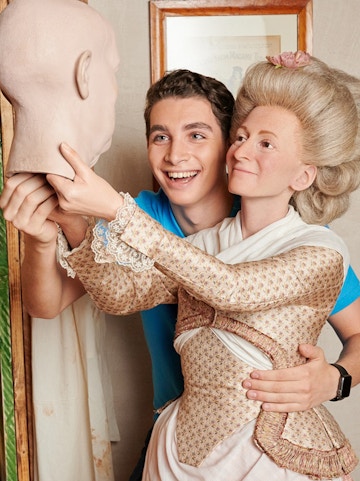 Man posing with wax figure at Madame Tussauds Berlin.