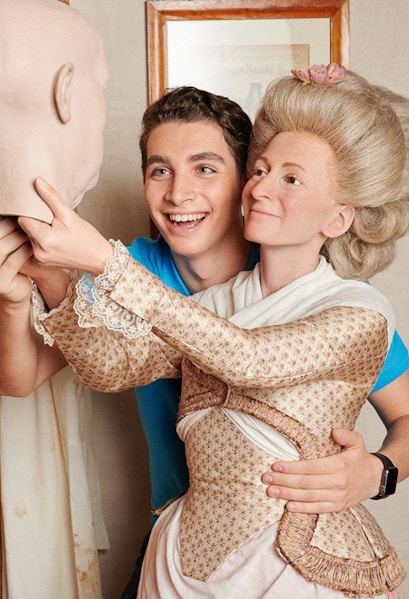 Man posing with wax figure at Madame Tussauds Berlin.