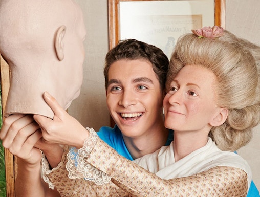 Man posing with wax figure at Madame Tussauds Berlin.