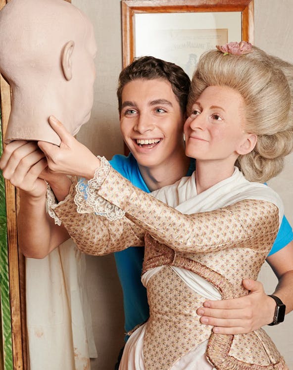 Man posing with wax figure at Madame Tussauds Berlin.