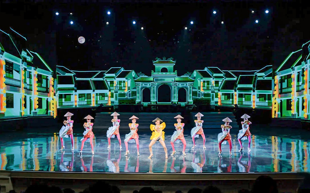 Performers in traditional costumes on stage at Colosseum Cabaret Show, Pattaya.
