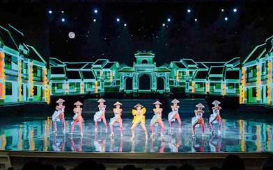 Performers in traditional costumes on stage at Colosseum Cabaret Show, Pattaya.
