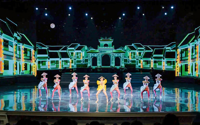 Performers in traditional costumes on stage at Colosseum Cabaret Show, Pattaya.