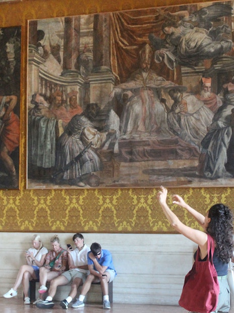 Visitors observing frescoes inside Palazzo Barberini during a guided tour.