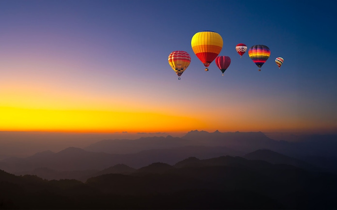 Hot-air balloons over Doi Luang Chiang Dao at sunrise, Chiang Mai.