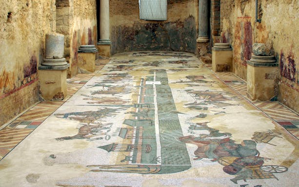Mosaic floor depicting chariot race at Villa Romana del Casale, Sicily.