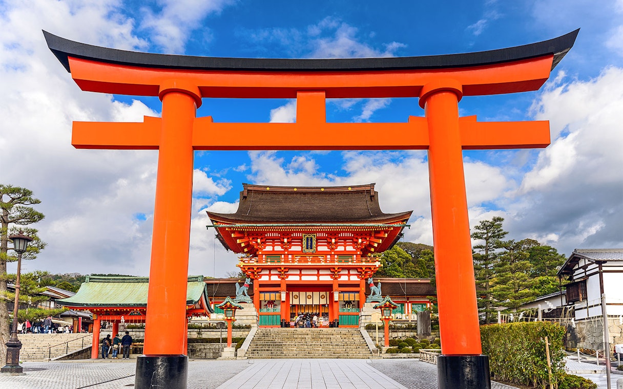 Fushimi Inari Shrine's iconic red torii gate on a day trip from Osaka.