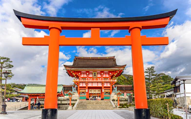 Fushimi Inari Shrine's iconic red torii gate on a day trip from Osaka.