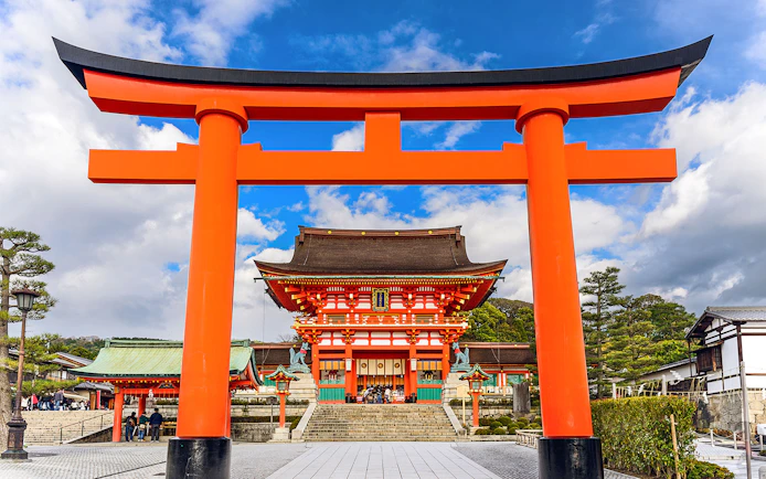 Fushimi Inari Shrine's iconic red torii gate on a day trip from Osaka.