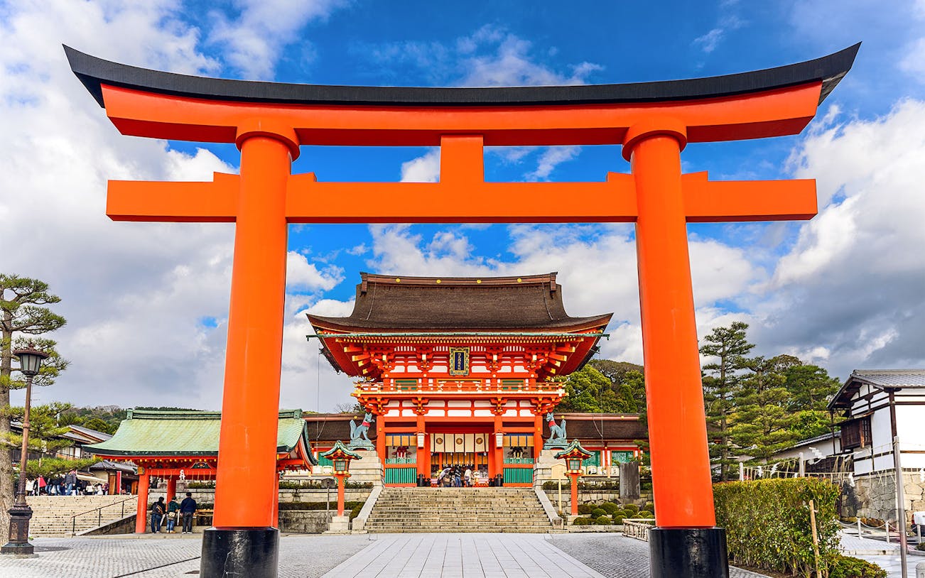 Fushimi Inari Shrine's iconic red torii gate on a day trip from Osaka.