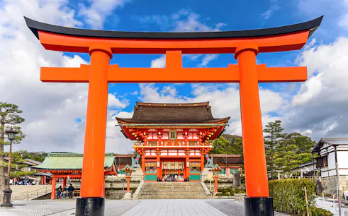 Fushimi Inari Shrine's iconic red torii gate on a day trip from Osaka.