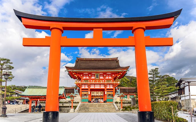 Fushimi Inari Shrine's iconic red torii gate on a day trip from Osaka.