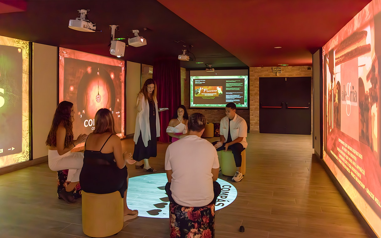 Group learning Flamenco rhythms in a classroom setting.
